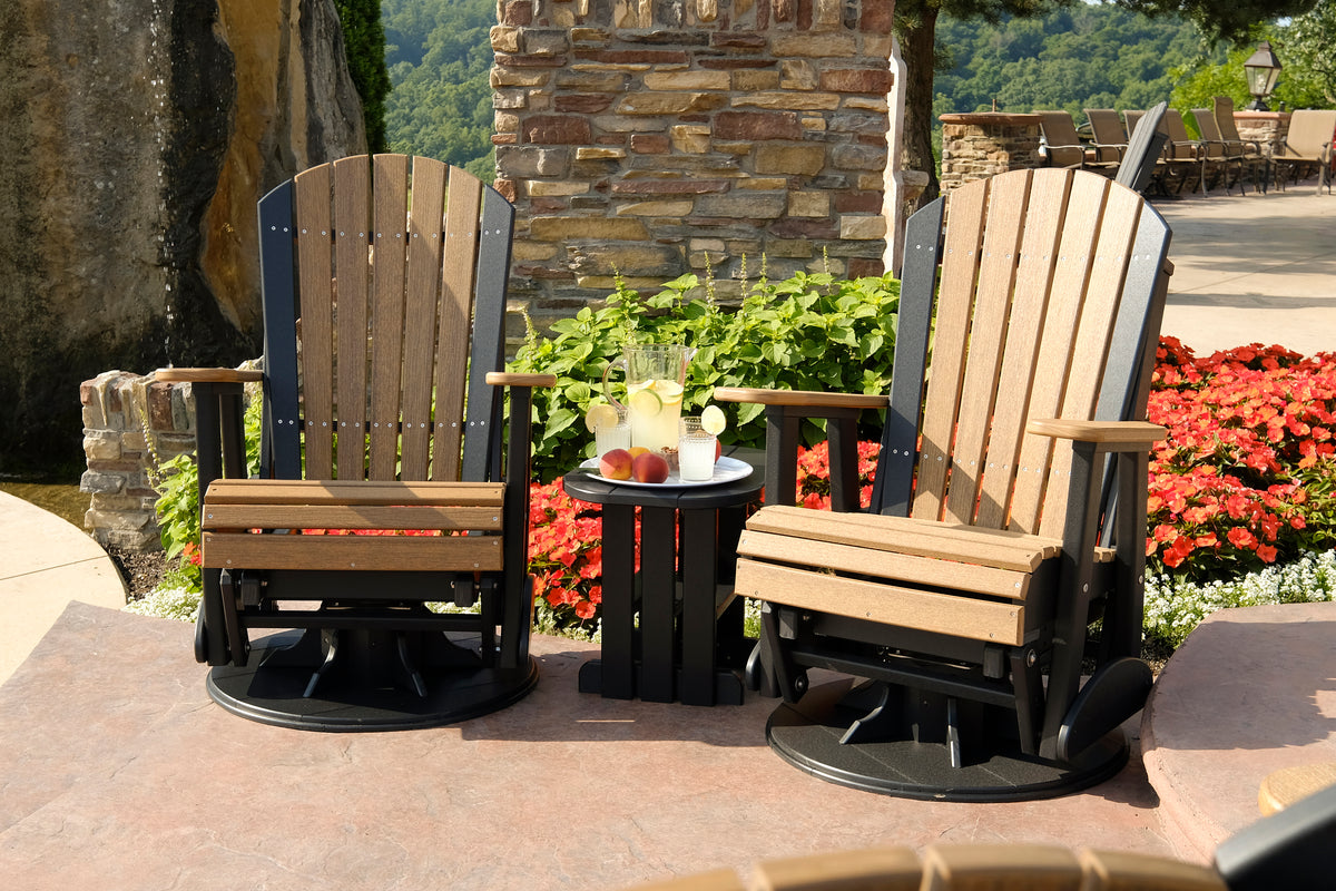 LuxCraft 2' Adirondack Swivel Glider in Black on a pool deck — 360-degree swivel and gliding motion for conversation from any angle